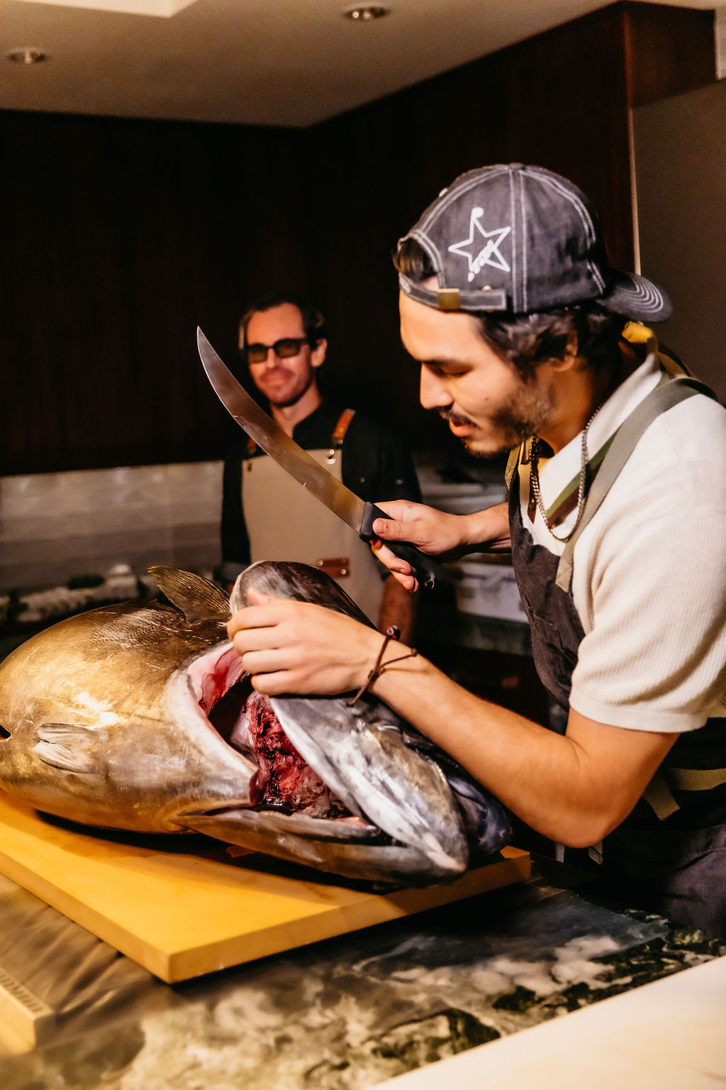 A master cutter mid-breakdown on a golden bluefin head