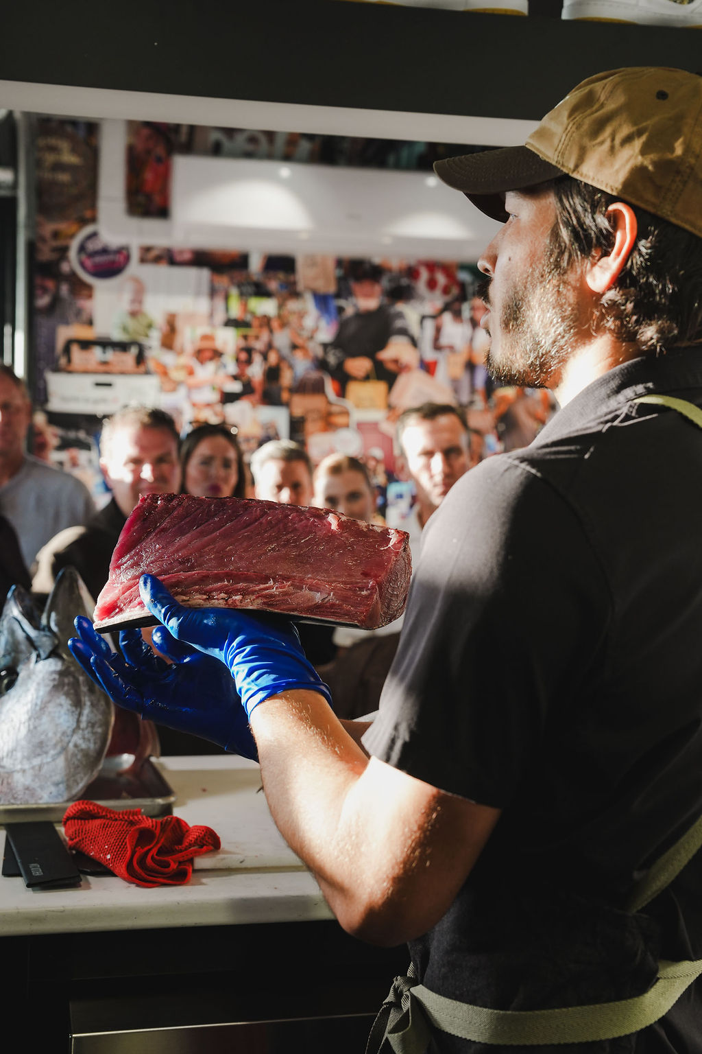 A chef presenting a prized cut of bluefin
