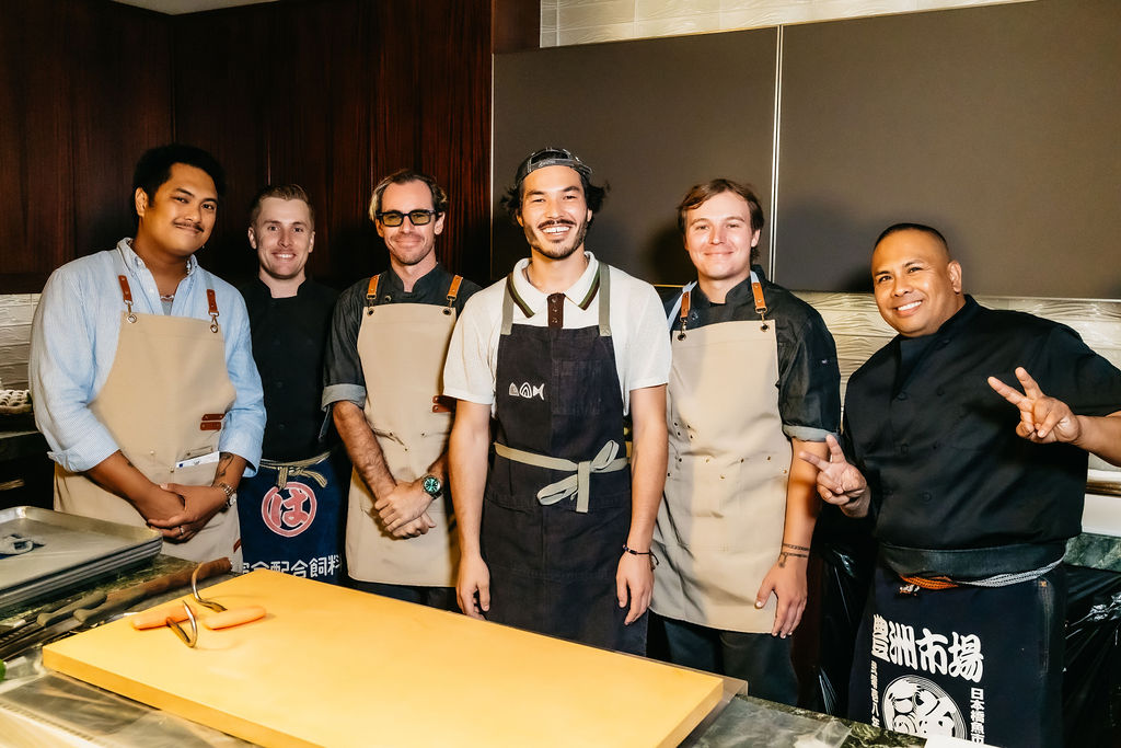 The Otoro Club team together in their aprons before service.